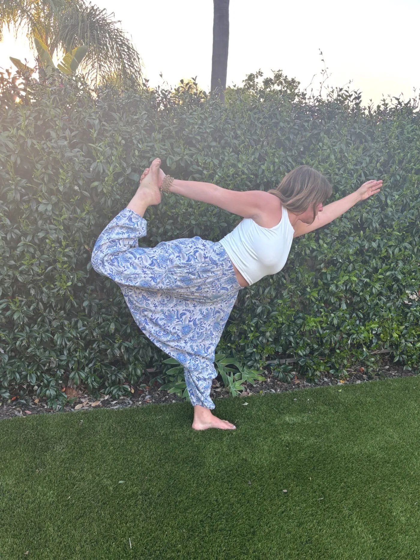 Kim Segal in dancer pose wearing BeautifulU hand block-printed 100% cotton yoga pants
