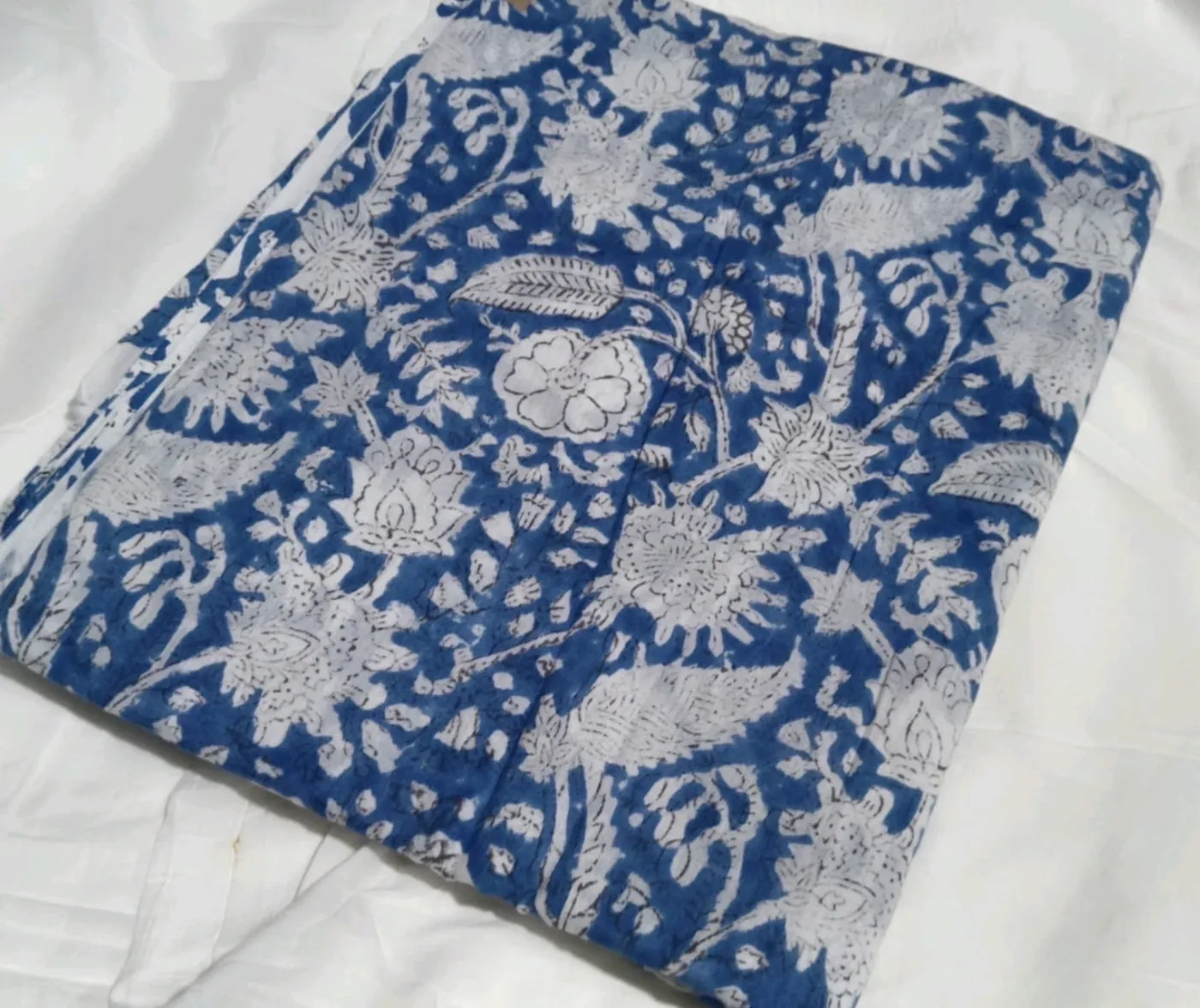 Close-up of Krishna Blue indigo floral block print on soft 100% cotton yoga pants fabric