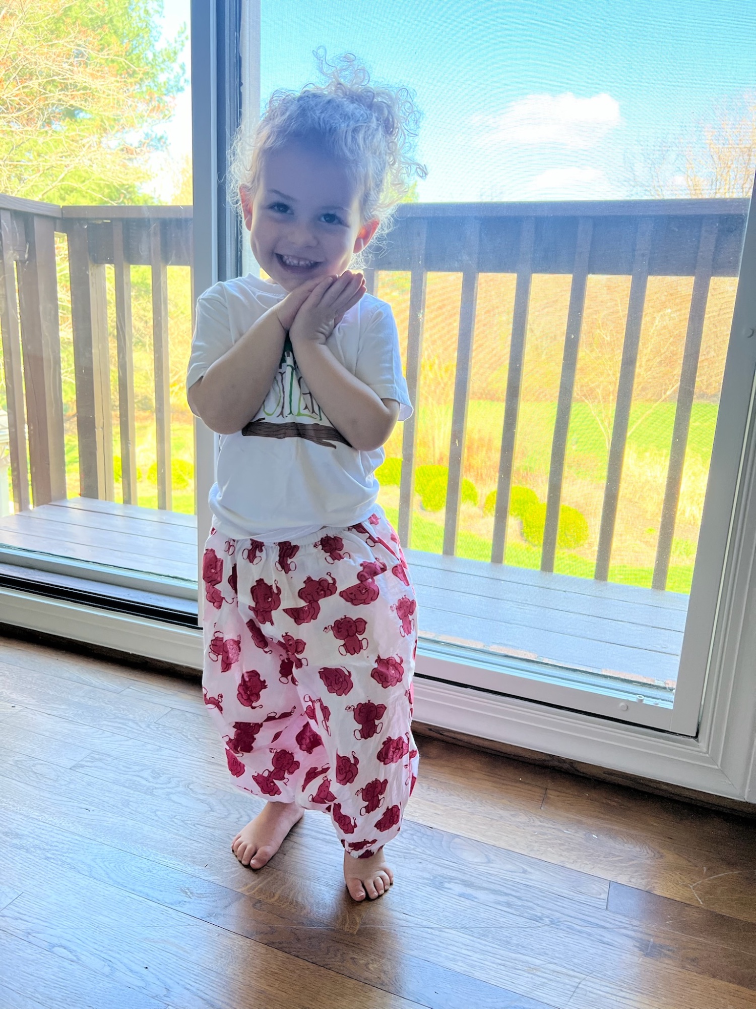 Little Elephant baby yoga pants worn by a smiling toddler